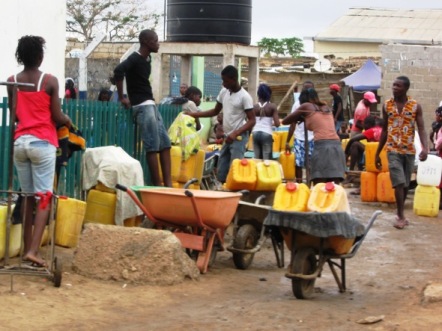 Having to walk up to 100 meters to get a bucket of water from a standpost, is considered adequate water coverage according to the Angolan Institute of Statistics. Photo courtesy DW. 
